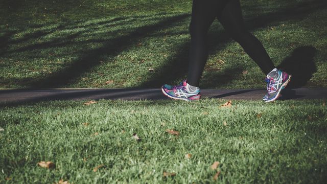 A person jogging in a park. 