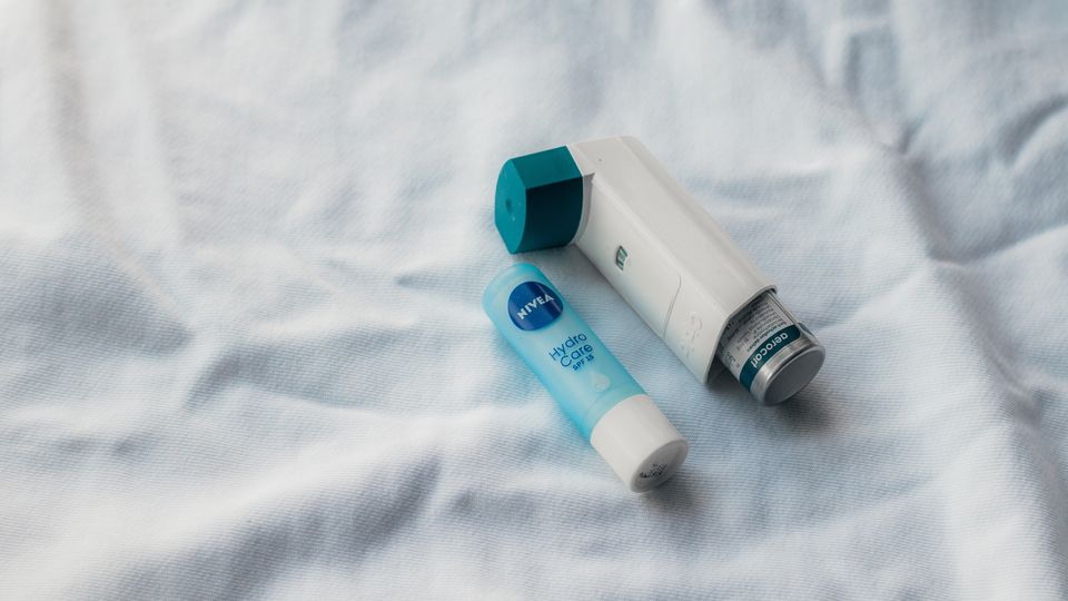 A lip balm and an asthma pump.