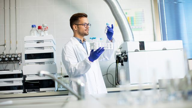 Lab Worker Working With HPLC 