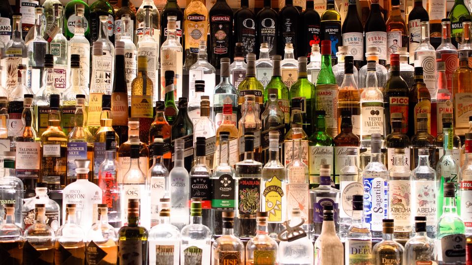 A bar filled with bottles of alcohol.